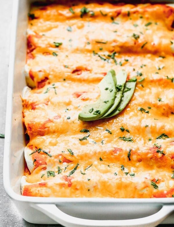 These Easy 5-Ingredient Chicken Enchiladas are still just as cheesy and still just as flavorful as enchiladas made completely scratch, but come together in virtually no time at all. Perfect for busy nights!