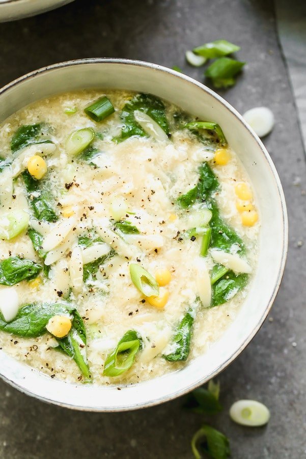 This Easy Vegetable Egg Drop Soup takes a simple classic to hearty new level. We amp up classic egg drop soup with lots of sweet corn, hearty spinach, and orzo noodles to transform this side soup into a dinner-worthy meal.