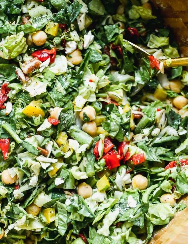 Easy Chopped Salad with tons of veggies, chickpeas, and an easy tahini vinaigrette.