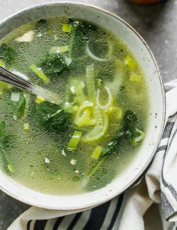 Our Detox Soup Recipe is the perfect way to jump-start your health after an indulgent weekend. We simmer chicken bones with tons of veggies, garlic, ginger, and lemongrass until the water turns into a deep, rich broth. Serve the broth with leeks, spinach and any of your other favorite veggies.