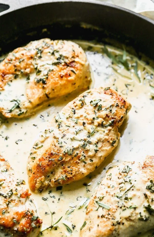 Our Creamy Tarragon Chicken is a great easy weeknight dinner that feels elevated. We sear chicken breasts in a cast-iron skillet and then simmer them in a creamy, garlicky tarragon and mustard sauce. Serve with veggies, pasta, or a little bit of creamy mashed potatoes.
