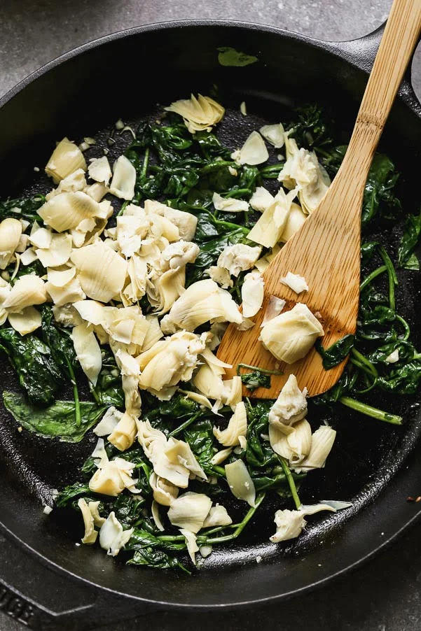 Spinach and artichoke in cast iron skillet