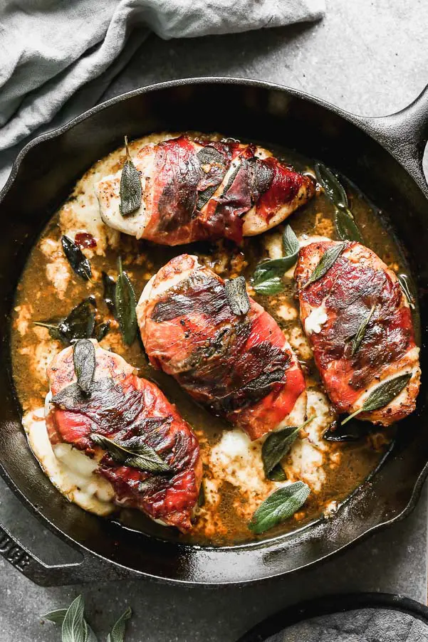 Another day, another chicken dinner. Our Baked Chicken Saltimbocca is a classic, with a twist. We take plump chicken breasts and stuff them with gooey fontina cheese, wrap them in sage and prosciutto, and then sear them in a mixture of butter and olive oil. The cheesy chicken breasts are then cooked in an easy marsala lemon sauce and served with plenty of fresh sage.&nbsp;