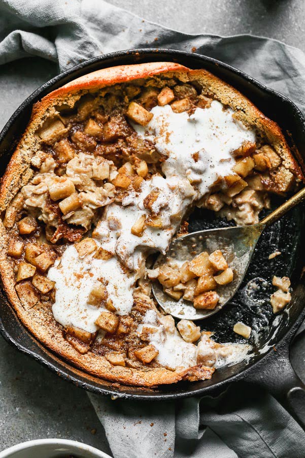 Our Caramel Apple Clafoutis Recipe is one of the easiest most impressive desserts you'll make all fall long. This pancake meets souffle baked dessert is studded with brown butter caramel apples, plenty of warm fall spices and baked until brown on the outside and soft and custard-like on the inside. Oh, and it's a cinch to throw together.&nbsp;