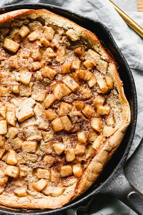 Our Caramel Apple Clafoutis Recipe is one of the easiest most impressive desserts you'll make all fall long. This pancake meets souffle baked dessert is studded with brown butter caramel apples, plenty of warm fall spices and baked until brown on the outside and soft and custard-like on the inside. Oh, and it's a cinch to throw together.&nbsp;