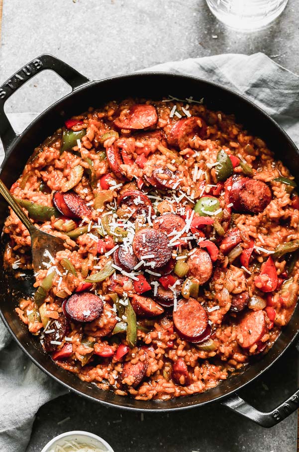 Spicy Cajun food meets creamy cheesy Italian food in our Cheesy Cajun Sausage Risotto. This one-pot wonder has everything you need in a hearty dinner - creamy arborio rice, plenty of veggies, spicy andouille sausage, and a cheese factor you'll fall in love with. 