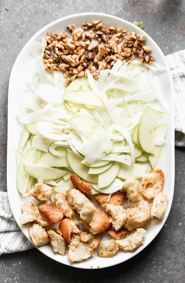 Shaved Fennel, shaved apples, toasted walnuts, and sourdough croutons