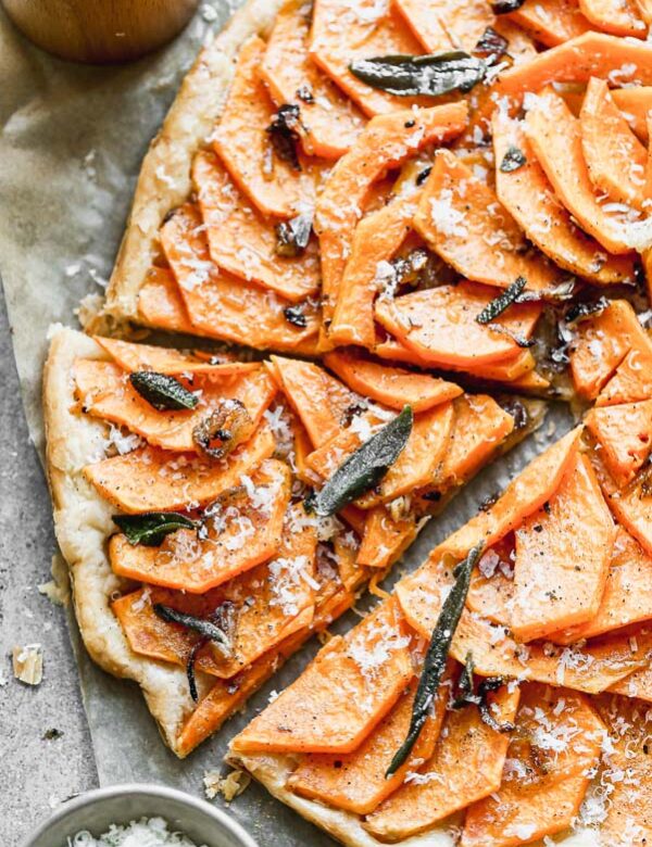 Our Butternut Squash Tart is not only a showstopper visually, but seriously delicious as well. We take sweet butternut squash laced with brown butter and shallots and layer it on crispy puff pastry. We top if off with plenty of parmesan cheese and, fried sage leaves, and flaky maldon sea salt.