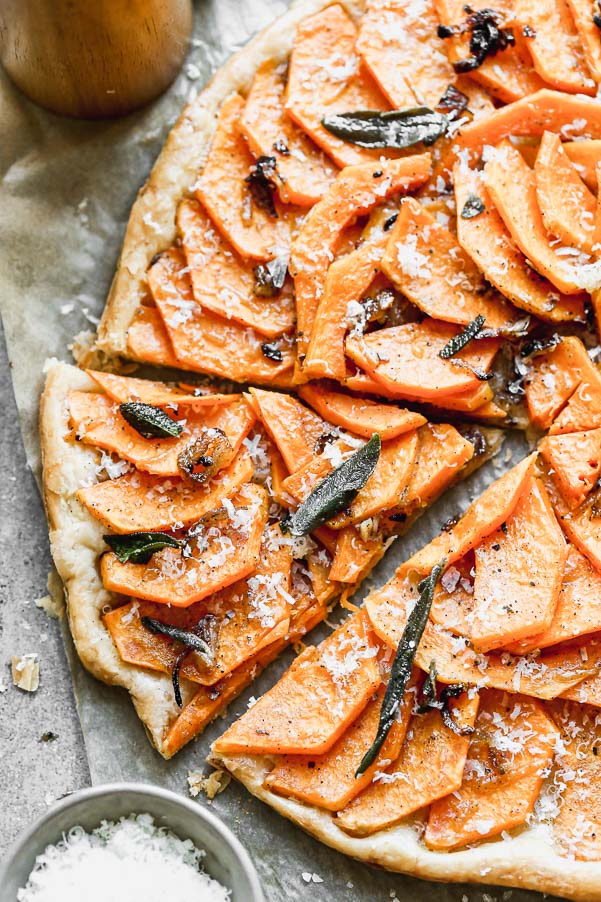 Our Butternut Squash Tart is not only a showstopper visually, but seriously delicious as well. We take sweet butternut squash laced with brown butter and shallots and layer it on crispy puff pastry. We top if off with plenty of parmesan cheese and, fried sage leaves, and flaky maldon sea salt.