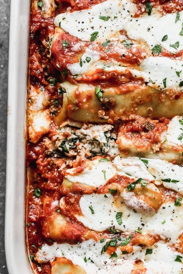 Our Chicken Cannelloni may be a labor of love, but rest assured, this is one great love story. We stuff homemade pasta sheets with a creamy ricotta, shredded chicken, and spinach, cover in our favorite marinara sauce, and gooey fresh mozzarella cheese and then bake until bubbly and you can no longer handle the smells permeating throughout your house. 