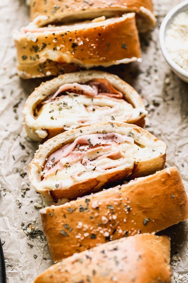 With just five ingredients, you can whip up our favorite easy lunch: Ham and Cheese Stromboli. We take frozen bread or pizza dough, layer it up with salty ham, gooey white American cheese, and then roll it up and bake. Simplicity at its finest, and oh-so cheesy.