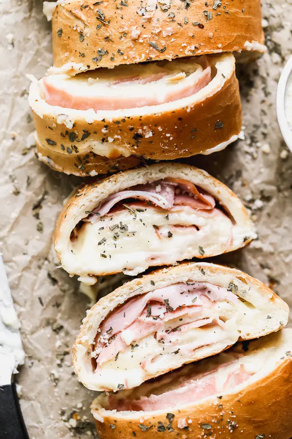 With just five ingredients, you can whip up our favorite easy lunch: Ham and Cheese Stromboli. We take frozen bread or pizza dough, layer it up with salty ham, gooey white American cheese, and then roll it up and bake. Simplicity at its finest, and oh-so cheesy.