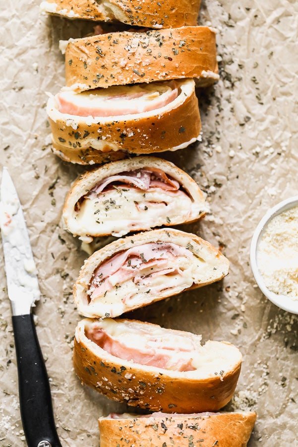 With just five ingredients, you can whip up our favorite easy lunch: Ham and Cheese Stromboli. We take frozen bread or pizza dough, layer it up with salty ham, gooey white American cheese, and then roll it up and bake. Simplicity at its finest, and oh-so cheesy.