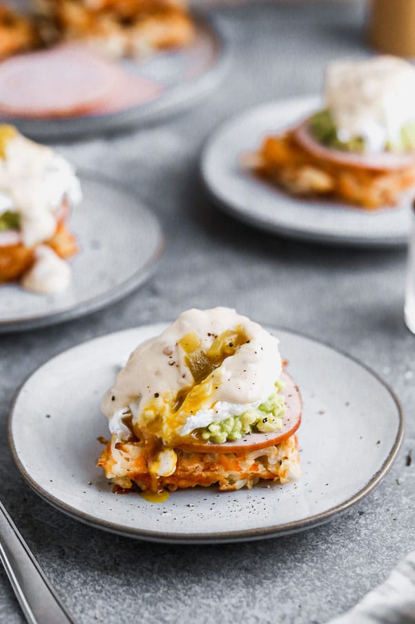 Green Chile Avocado Eggs Benedict swaps out an English muffin for a cheesy, crispy hash brown waffle base. We top it with citrusy smashed avocado, hickory-smoked Canadian Bacon and a cheesy green chile-infused mornay sauce. Brunch heaven!