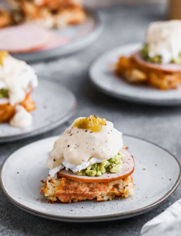 We have put a twist on everyone’s favorite brunch item – eggs benedict! Our Green Chile Avocado Eggs Benedict swaps out an English muffin for a cheesy, crispy hash brown waffle base. We top it with citrusy smashed avocado, hickory-smoked Canadian Bacon and a cheesy green chile-infused mornay sauce. Brunch heaven!