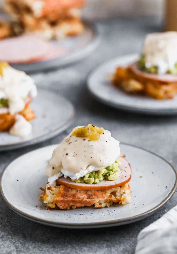 We have put a twist on everyone’s favorite brunch item – eggs benedict! Our Green Chile Avocado Eggs Benedict swaps out an English muffin for a cheesy, crispy hash brown waffle base. We top it with citrusy smashed avocado, hickory-smoked Canadian Bacon and a cheesy green chile-infused mornay sauce. Brunch heaven!