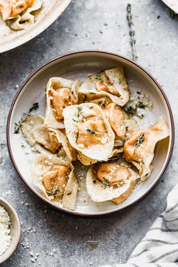 Let's make ravioli from scratch! But in the easiest way possible. Our Squash Ravioli with Thyme Butter is just simple five ingredients and uses wonton wrappers instead of fresh pasta. This is an easy semi-homemade ravioli anyone can make at home! 