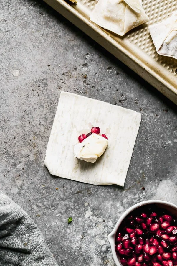 Brie and Pomegranates on wonton wrapper