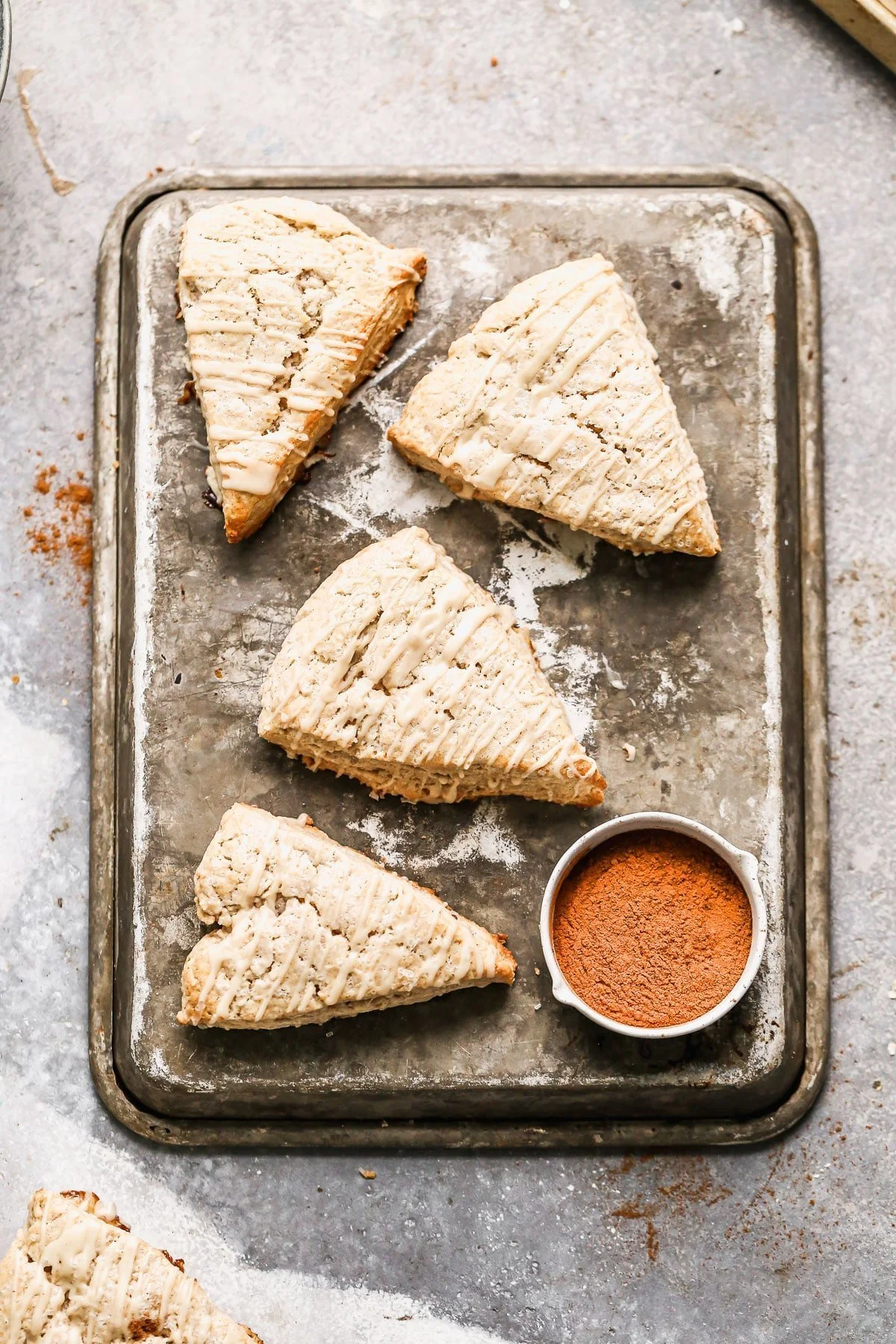 Crumbly, but soft with hints of cinnamon and flaked maldon salt, our Cinnamon Maple Scones are the perfect way to treat yourself. They're sweet, but not overly so and have a subtle maple flavor both in the scone itself and in the simple maple glaze we drizzle on top.