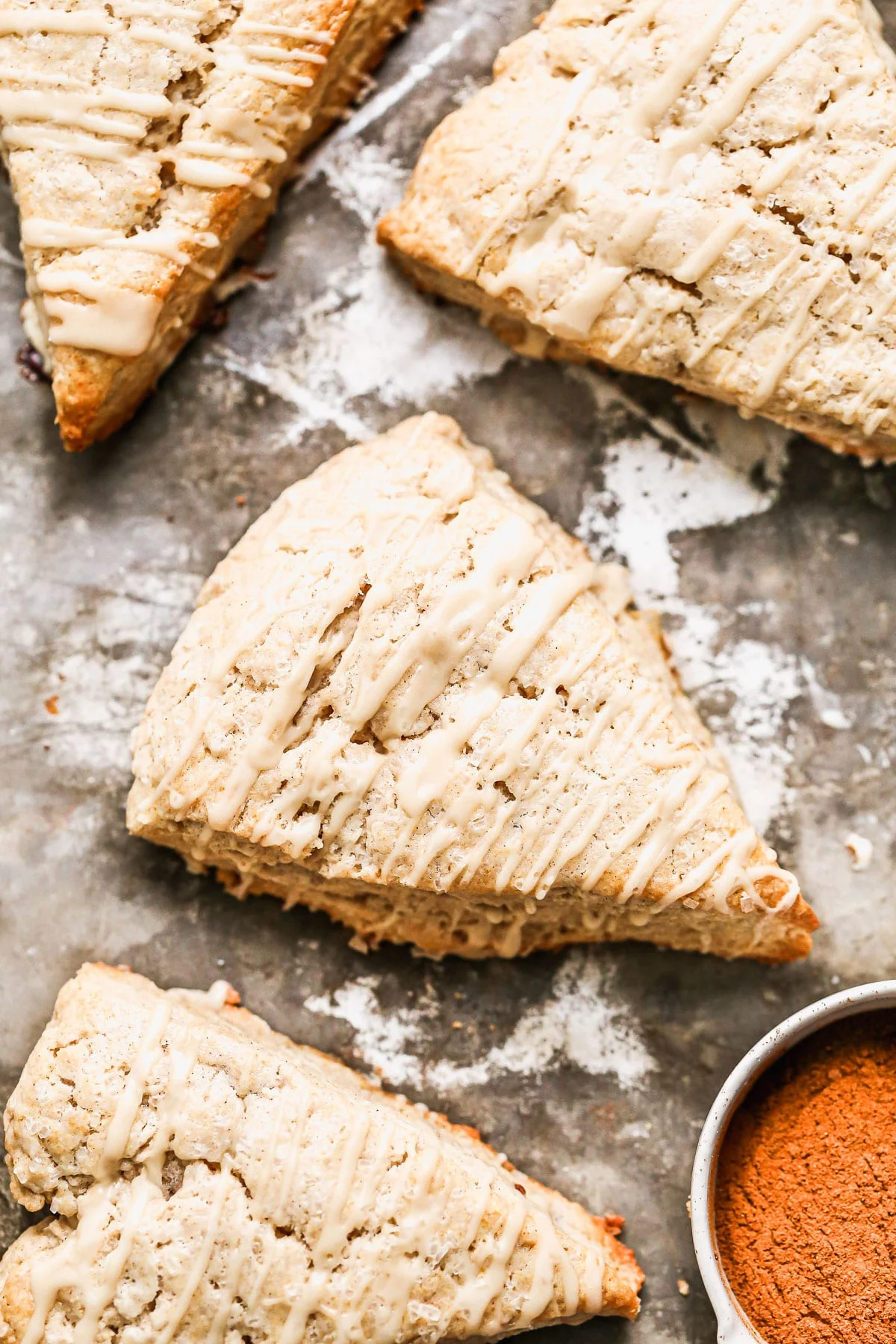 Crumbly, but soft with hints of cinnamon and flaked maldon salt, our Cinnamon Maple Scones are the perfect way to treat yourself. They're sweet, but not overly so and have a subtle maple flavor both in the scone itself and in the simple maple glaze we drizzle on top.