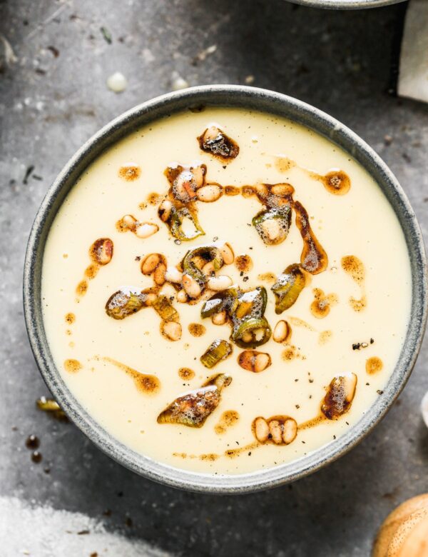 Our version of a Leek and Potato Soup includes all of the star ingredients you'd normally see, but we take it up a notch with notes of brown butter, shallot and a pop acid at the end. Adding a sprinkling of crunchy fried brown butter pine nuts and leeks as the finishing touch not only adds a pop of texture and flavor with each bite, but truly makes this Creamy Leek and Potato Soup restaurant quality.