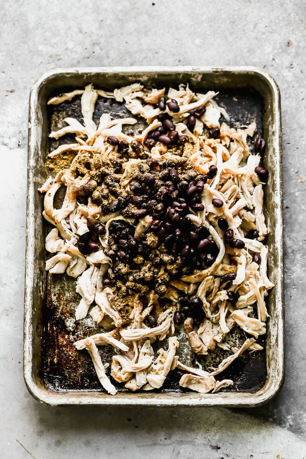 Shredded chicken tossed with black beans, cumin, salt, and pepper. 