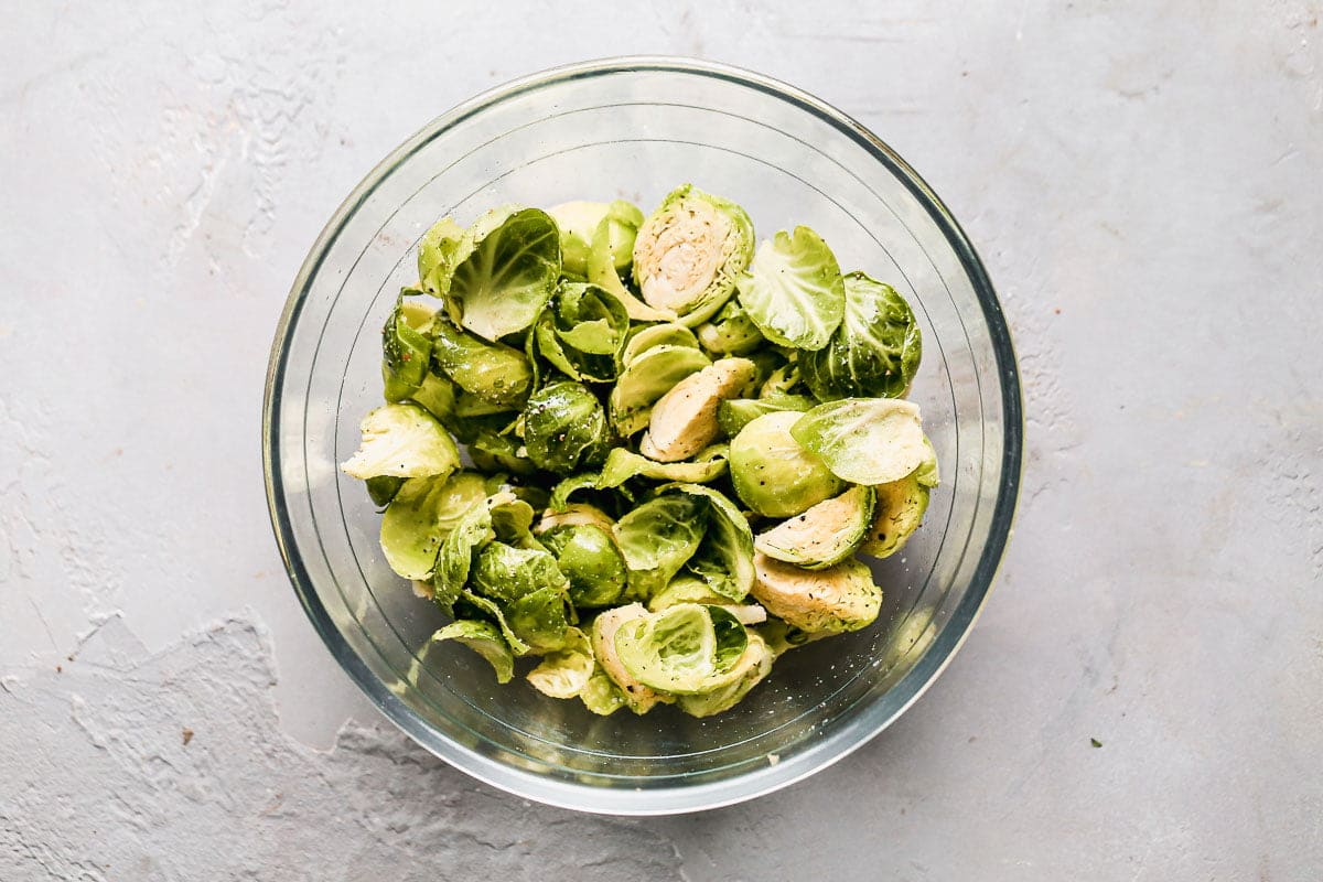 Chopped Brussels sprouts coated in olive oil, salt and pepper. 