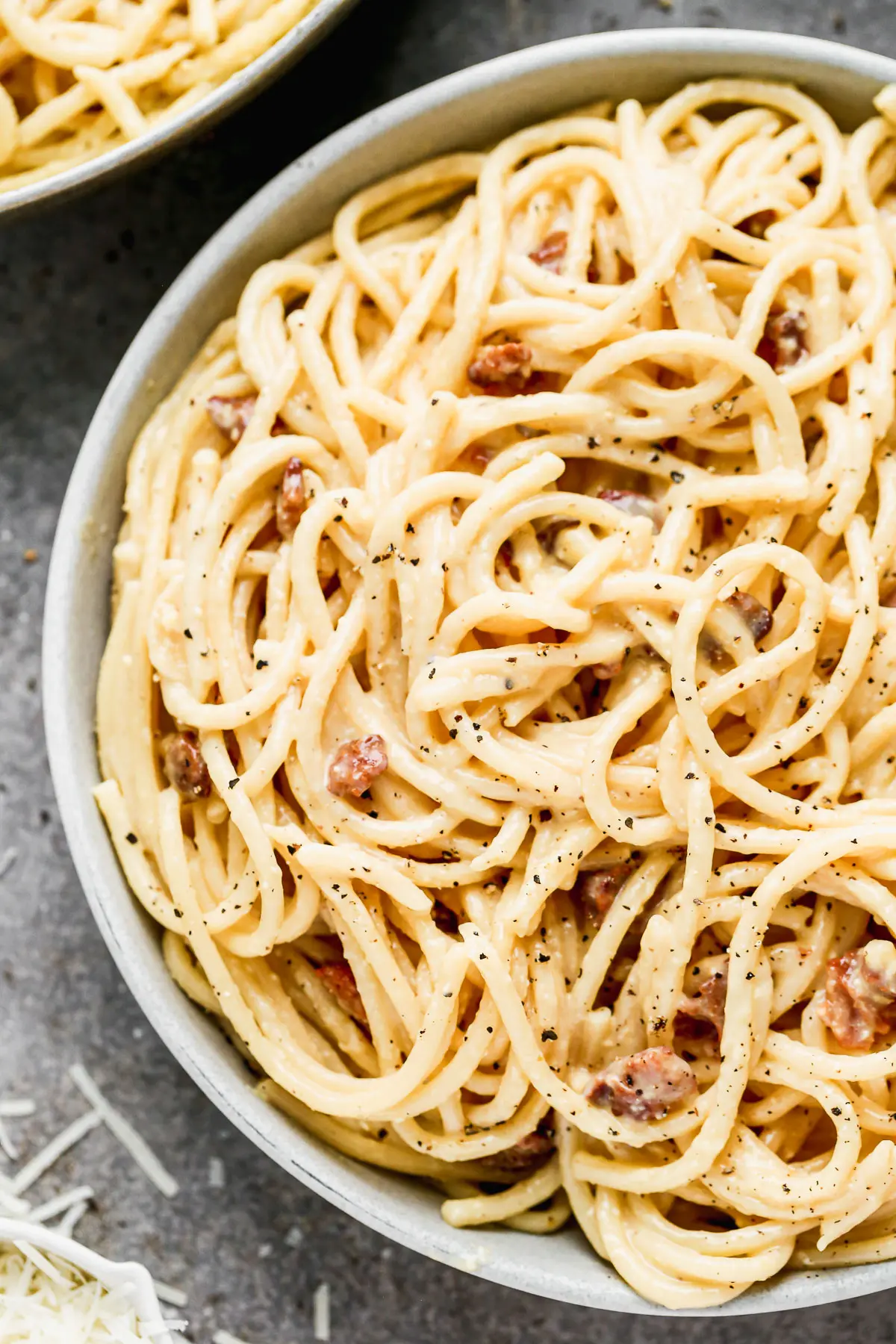 Silky-smooth noodles twirled in a rich, creamy (but cream-less) sauce, nutty pecorino cheese, and bits of salty bacon, our Bucatini Carbonara is the ultimate in Italian comfort food and arguably, the simplest. &nbsp;Our version amps up the amount of both cheese and bacon, adds in a little bit of garlic, and swaps out classic spaghetti for thick bucatini noodles.