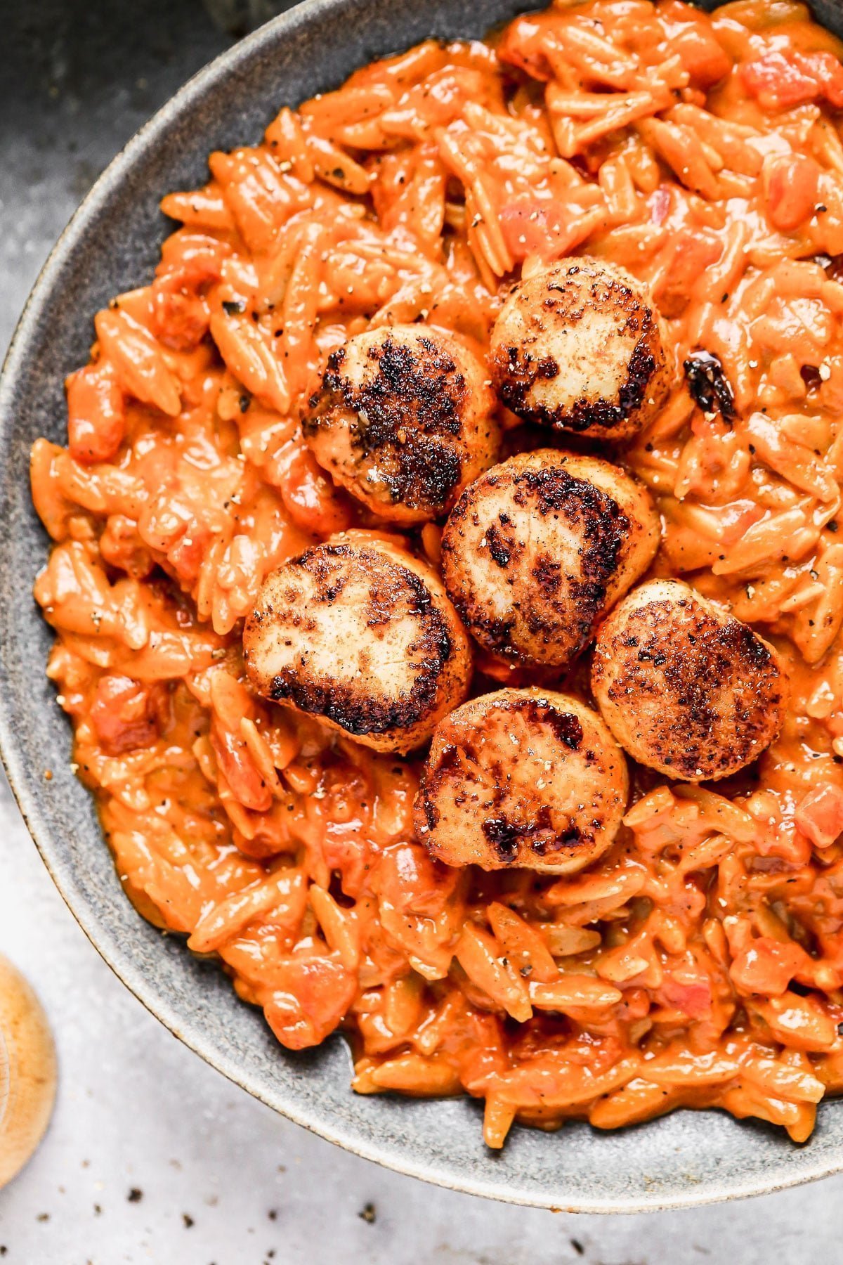 Our&nbsp;Buttery Tomato Orzo with Blackened Scallops&nbsp;has all of the creaminess of a&nbsp;traditional risotto, but is made a little bit healthier with the addition of whole-wheat orzo. It's packed with luscious tomato flavor rivaling the most perfect marinara and hints of nutty brown butter, making it my current favorite thing to eat. We serve ours with perfectly seared blackened scallops, but the protein of choice is up to you.&nbsp;