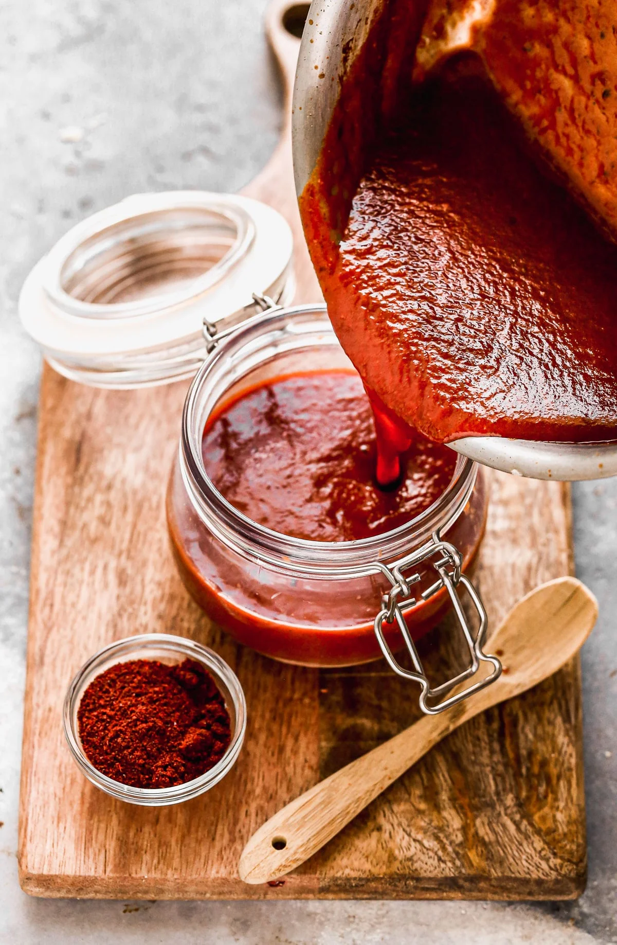 With just a few staple pantry ingredients and 15 minutes of your time, you can whip up an Enchilada Sauce Recipe infinitely better than anything you'll find at the grocery store. Our version is tangy, smoky, and slightly sweet with just a touch of heat. Perfect on enchiladas, tacos, or quick tex-mex inspired pastas.
