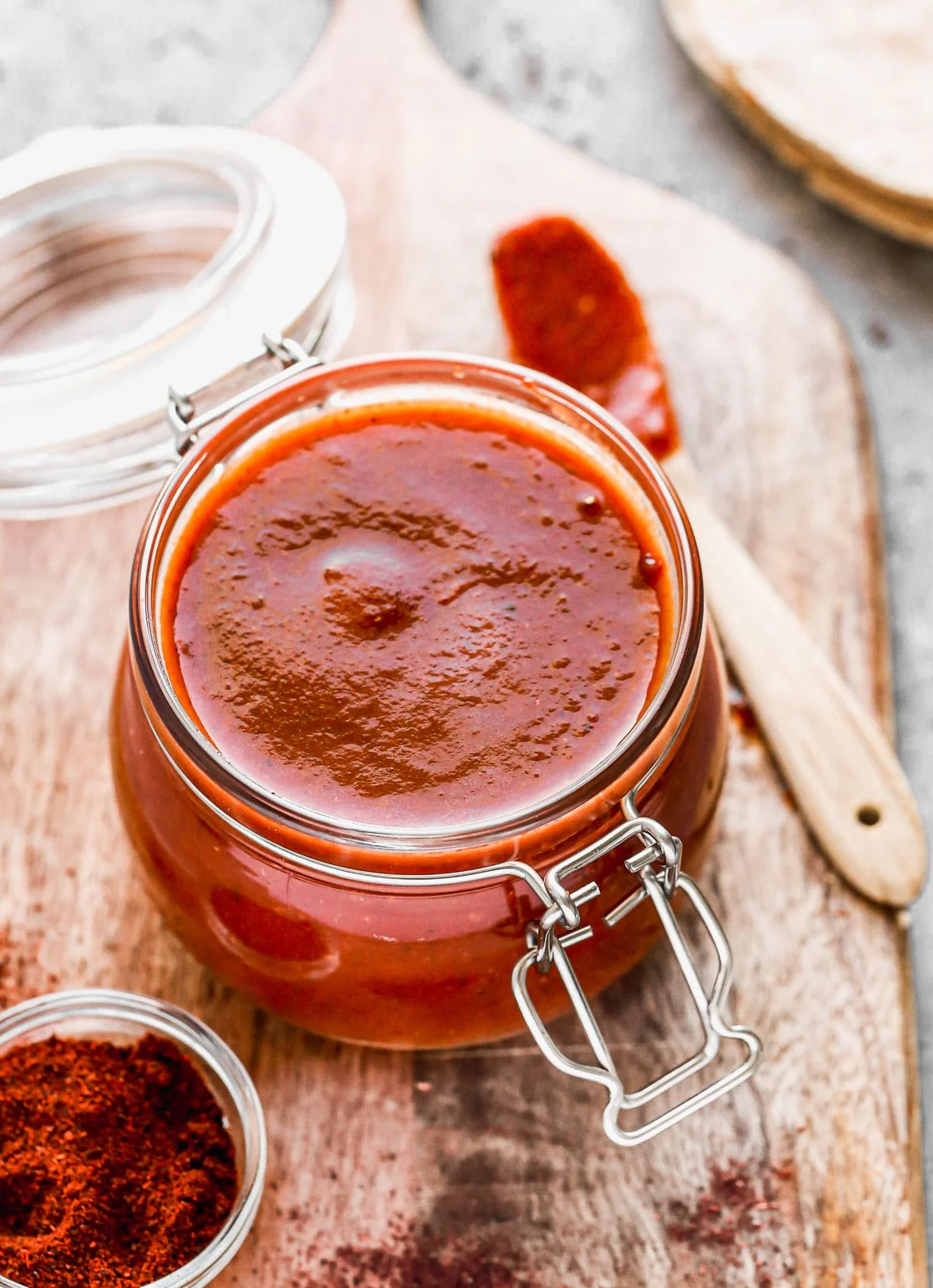 With just a few staple pantry ingredients and 15 minutes of your time, you can whip up an Enchilada Sauce Recipe infinitely better than anything you'll find at the grocery store. Our version is tangy, smoky, and slightly sweet with just a touch of heat. Perfect on enchiladas, tacos, or quick tex-mex inspired pastas.