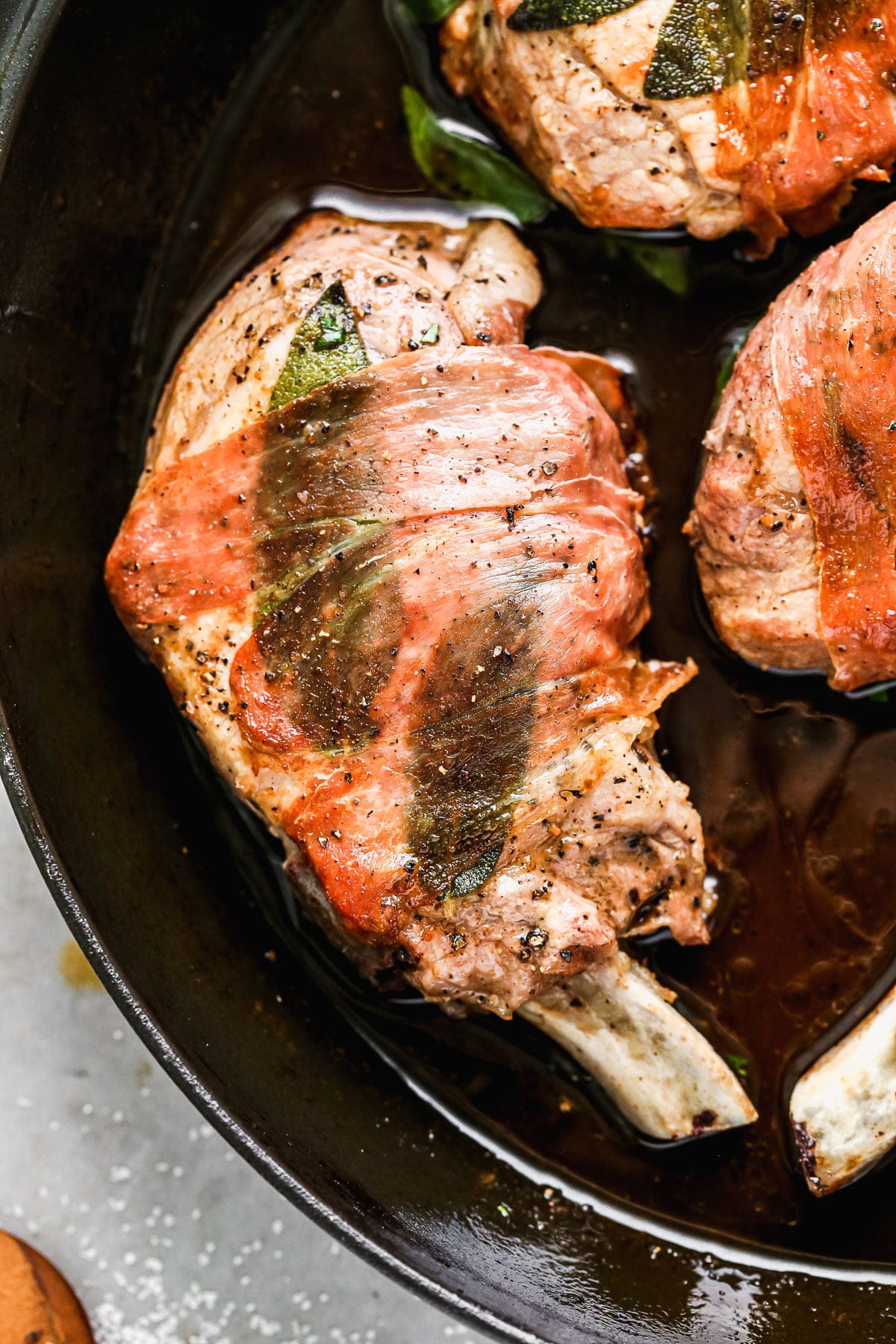 A showstopper juicy pork chop wrapped in prosciutto and sage and bathed in a luscious marsala wine sauce. Healthy and delicious! 