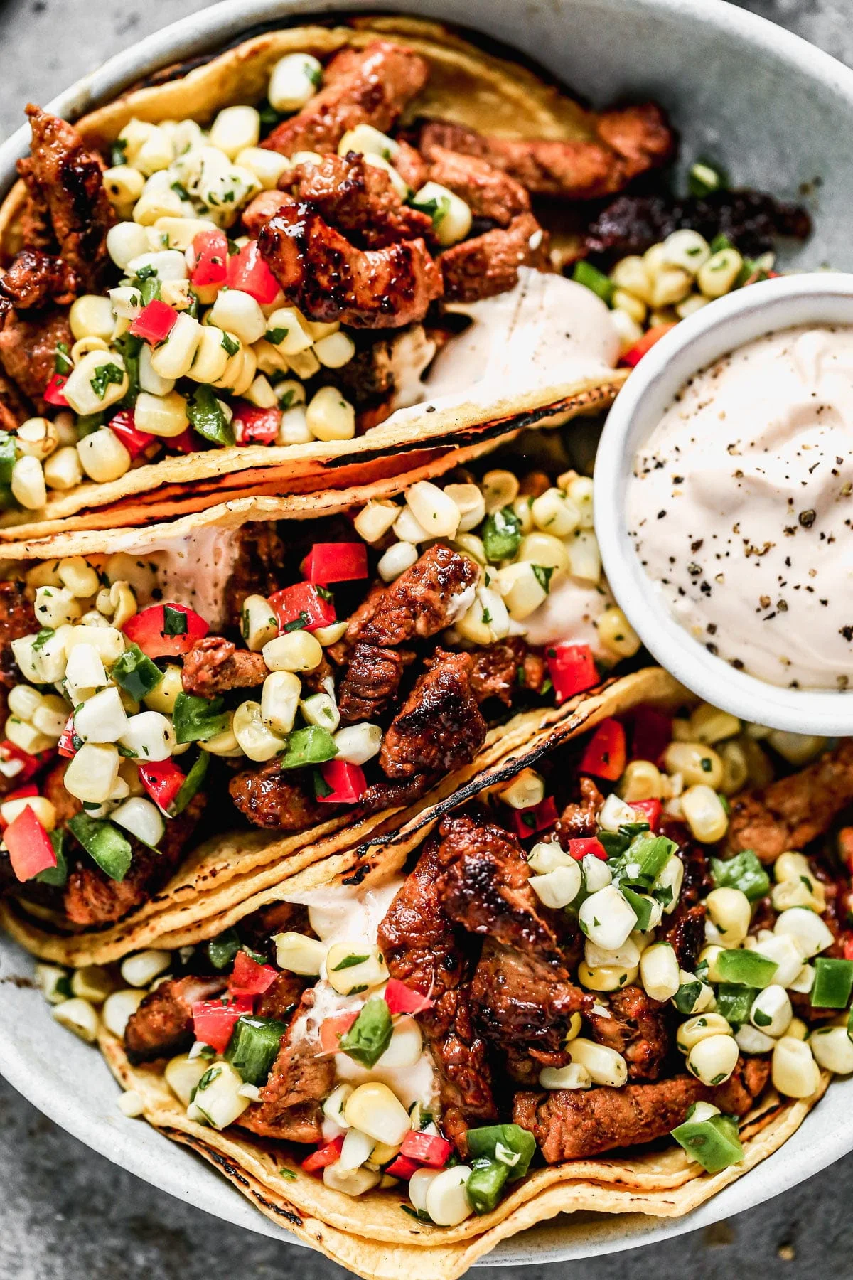 Crispy Pork Tenderloin Tacos with Corn Salsa and Chipotle Cream