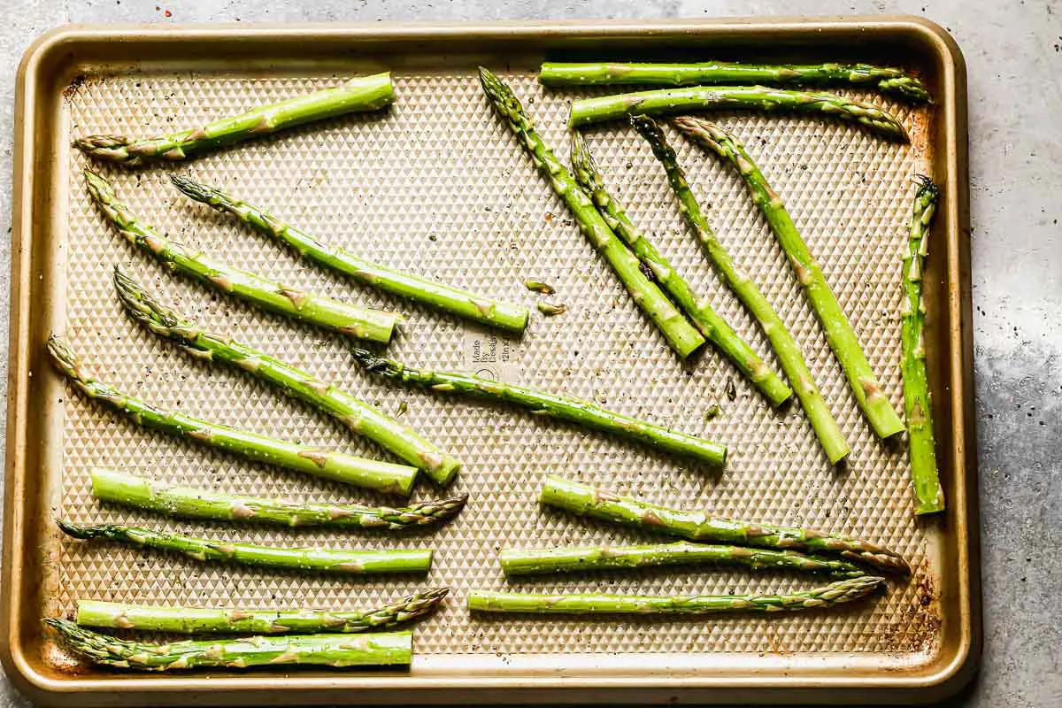Spread asparagus out on a sheet pan