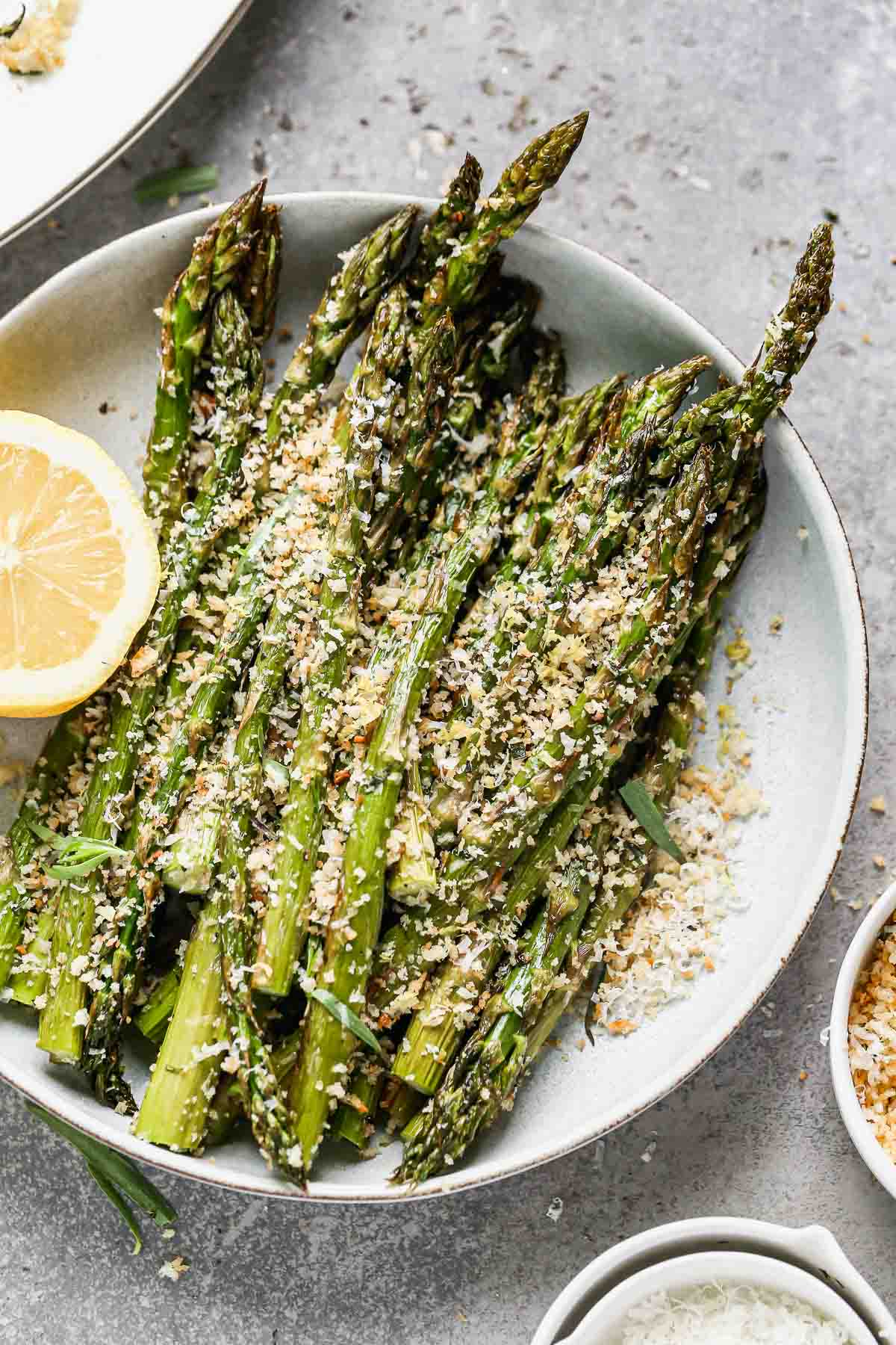 Tender and crispy on the outside with a slight bite on the inside, and covered in cheesy garlicky breadcrumbs (with hints of lemon!), our Easy Roasted Asparagus with Breadcrumbs is the perfect way to up your roasted veggie game this spring. Make a double or triple batch to feed a crowd, or scale it back to feed a family of four. 