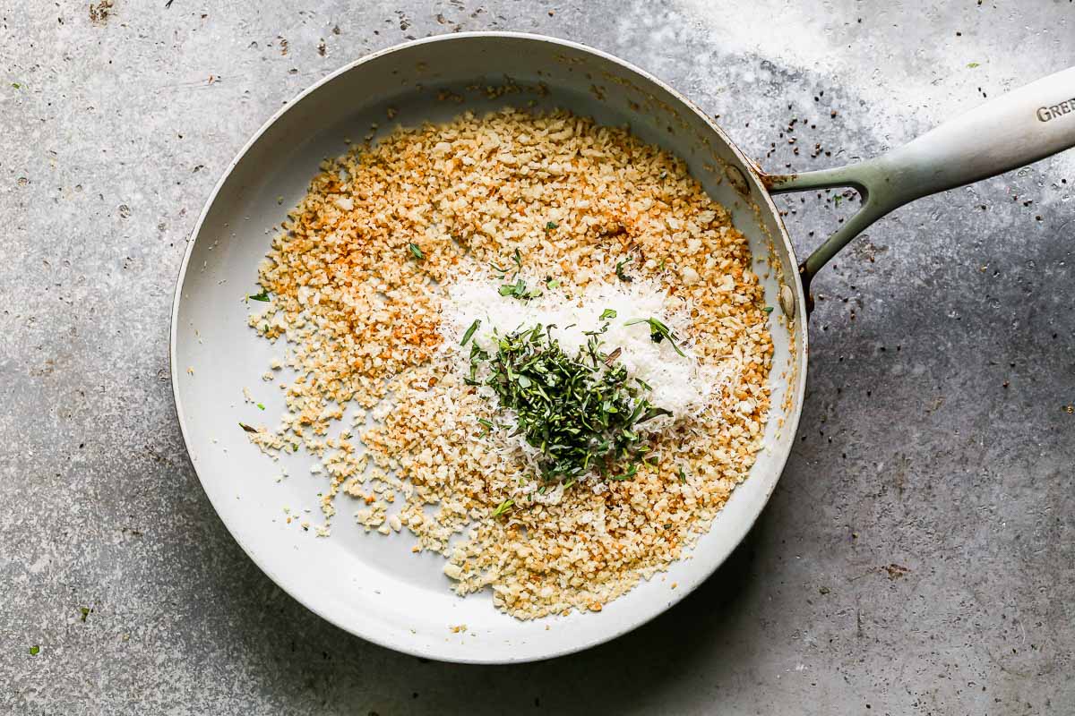 Add parmesan cheese and tarragon to breadcrumbs.