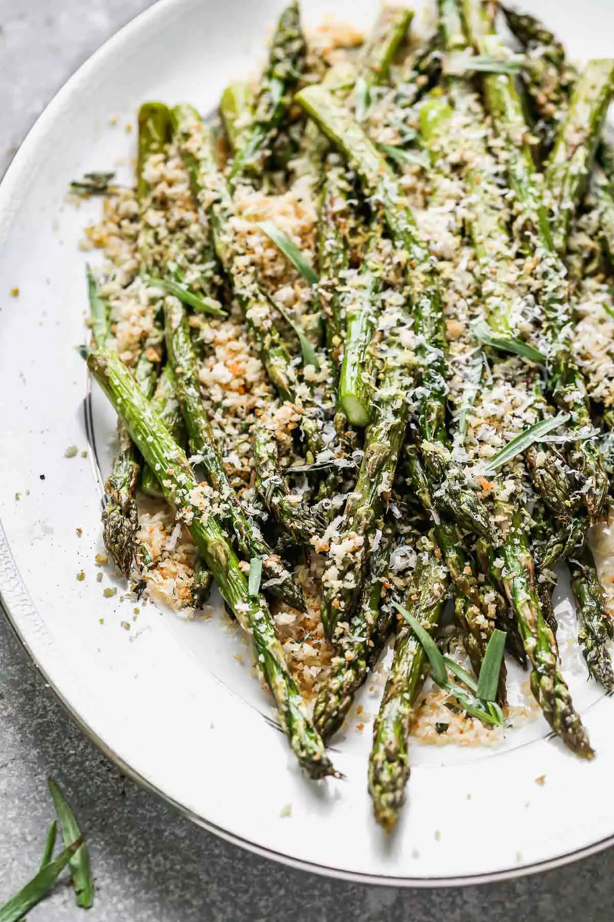 Tender and crispy on the outside with a slight bite on the inside, and covered in cheesy garlicky breadcrumbs (with hints of lemon!), our Easy Roasted Asparagus with Breadcrumbs is the perfect way to up your roasted veggie game this spring. Make a double or triple batch to feed a crowd, or scale it back to feed a family of four. 