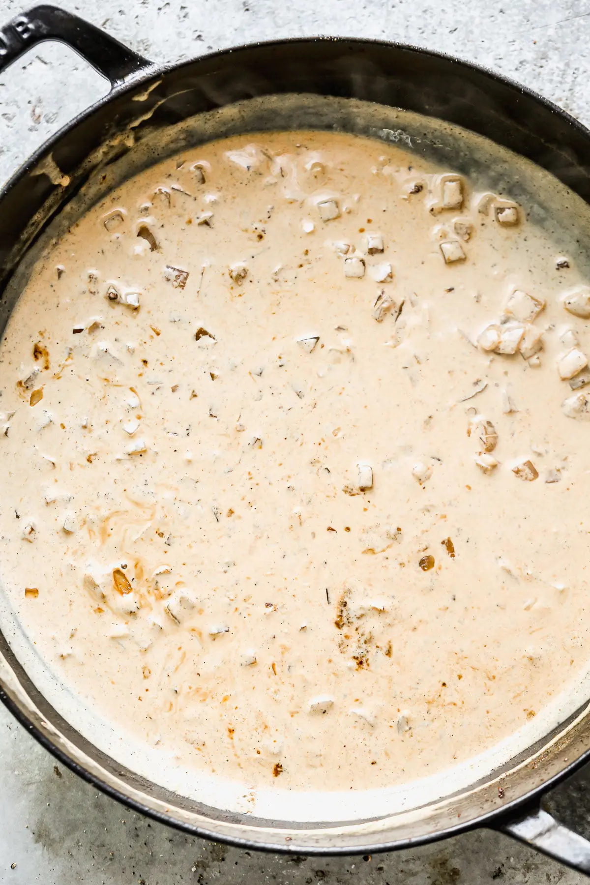 Chicken stock and cream simmering. 