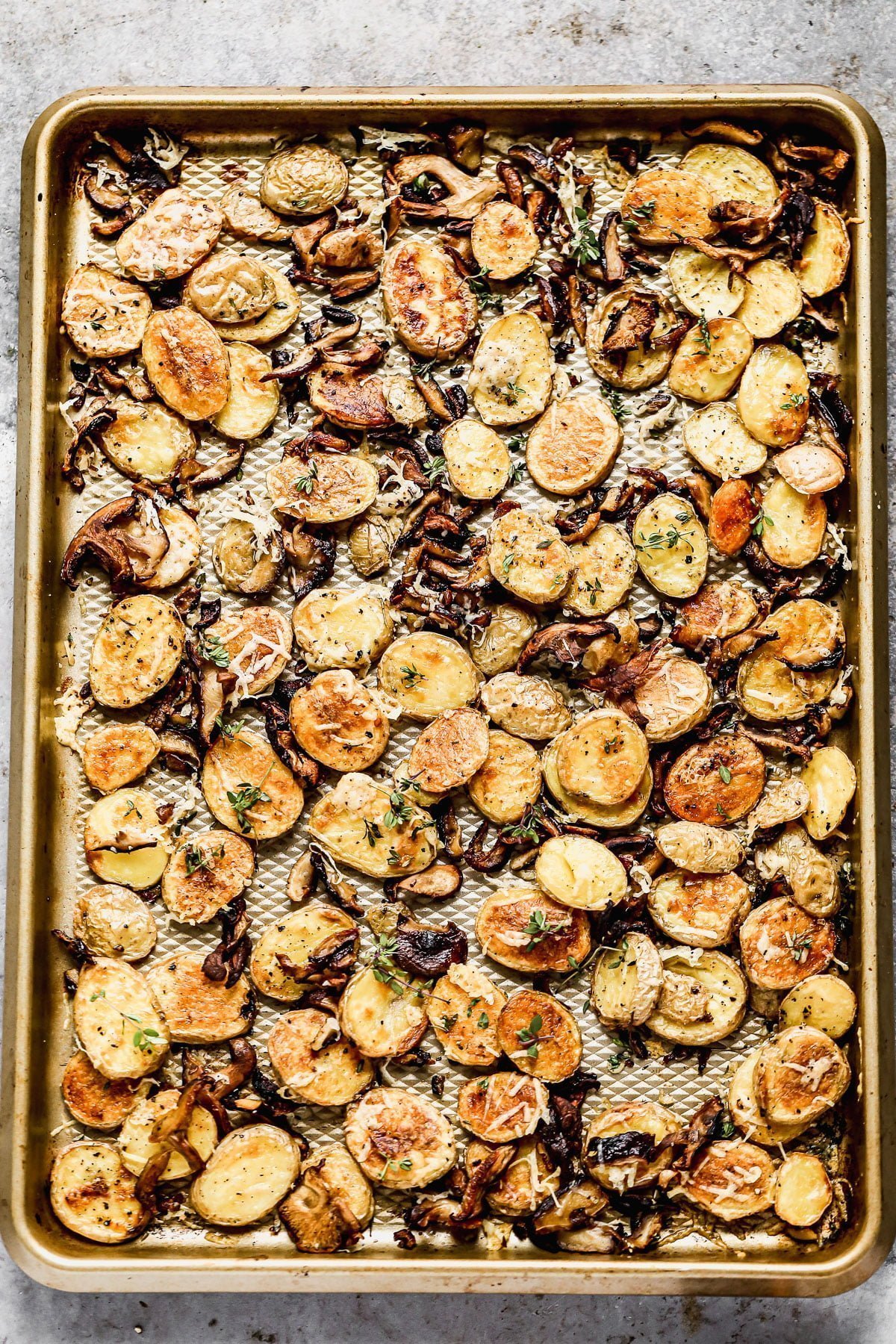 Crispy Parmesan Roasted Potatoes and Mushrooms, always. We roast buttery yukon gold potatoes and woodsy shiitake mushrooms until they're irresistibly crispy and golden, then toss them with nutty parmesan cheese and fresh thyme. Simple, but so delicious. &nbsp;