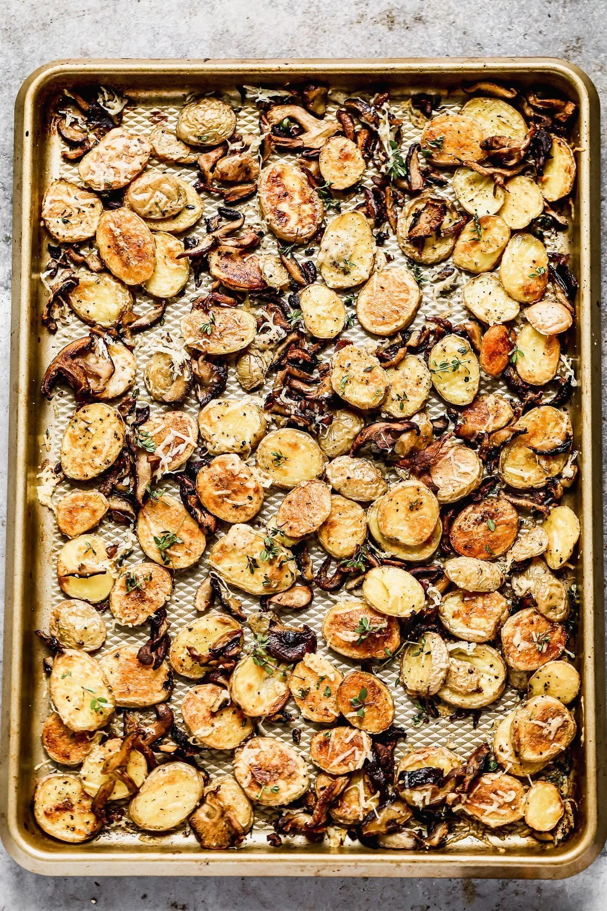 Crispy Parmesan Roasted Potatoes and Mushrooms, always. We roast buttery yukon gold potatoes and woodsy shiitake mushrooms until they're irresistibly crispy and golden, then toss them with nutty parmesan cheese and fresh thyme. Simple, but so delicious.  