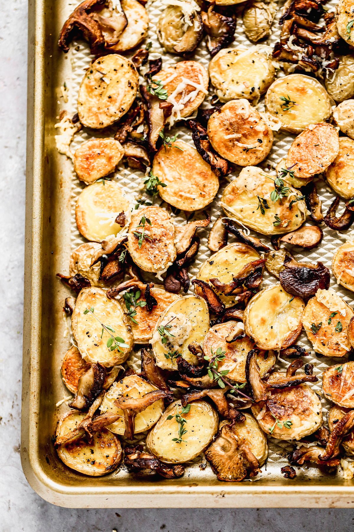 Crispy Parmesan Roasted Potatoes and Mushrooms, always. We roast buttery yukon gold potatoes and woodsy shiitake mushrooms until they're irresistibly crispy and golden, then toss them with nutty parmesan cheese and fresh thyme. Simple, but so delicious. &nbsp;