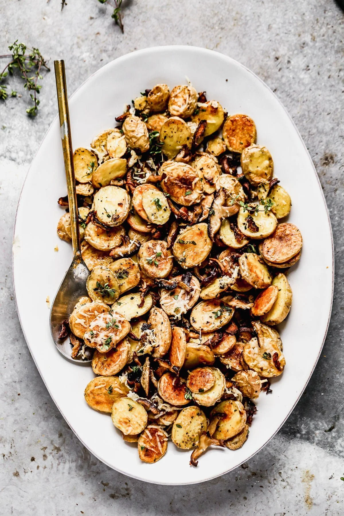 Crispy Parmesan Roasted Potatoes and Mushrooms, always. We roast buttery yukon gold potatoes and woodsy shiitake mushrooms until they're irresistibly crispy and golden, then toss them with nutty parmesan cheese and fresh thyme. Simple, but so delicious. &nbsp;