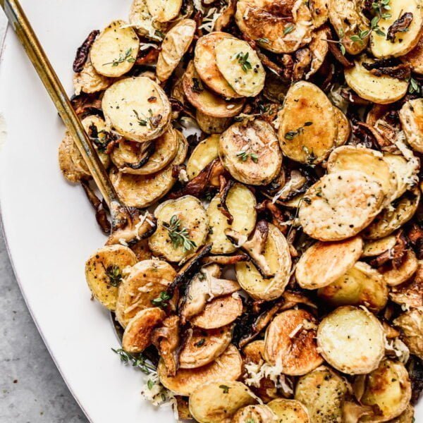 Crispy Parmesan Roasted Potatoes and Mushrooms, always. We roast buttery yukon gold potatoes and woodsy shiitake mushrooms until they're irresistibly crispy and golden, then toss them with nutty parmesan cheese and fresh thyme. Simple, but so delicious.  