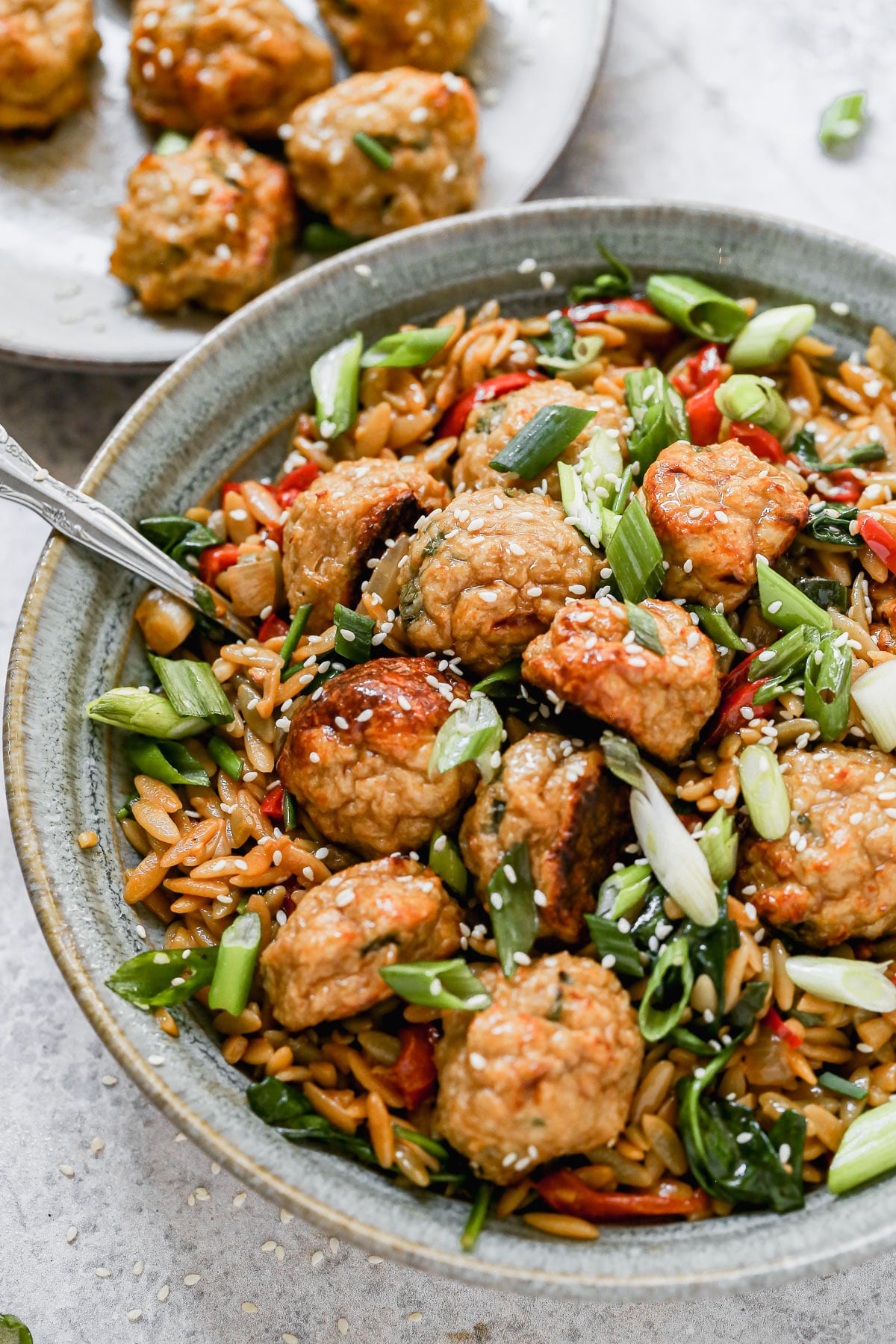 Our current favorite was to do meatballs: Asian Chicken Meatballs with Saucy Sesame and Hoisin Orzo. This fun spin on a classic pairs tender, garlic and ginger BAKED meatballs with an orzo full of veggies and an addictive sauce you'll want to lick with the a spoon. Prep ahead and eat later in the week! 