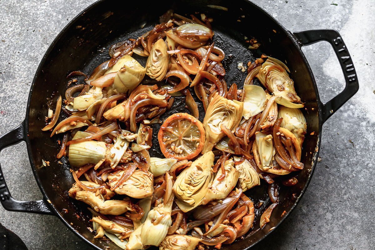 Caramelize onions and artichokes