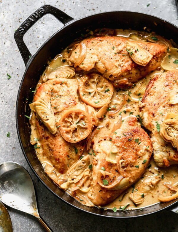 Swimming in a luscious lemon-infused wine sauce and studded with briny artichokes and sweet caramelized onions, our Chicken with Artichokes is the perfect bright springy dish to whip up when we also need a little cozy for those curve ball cold days we all get this time of year. 