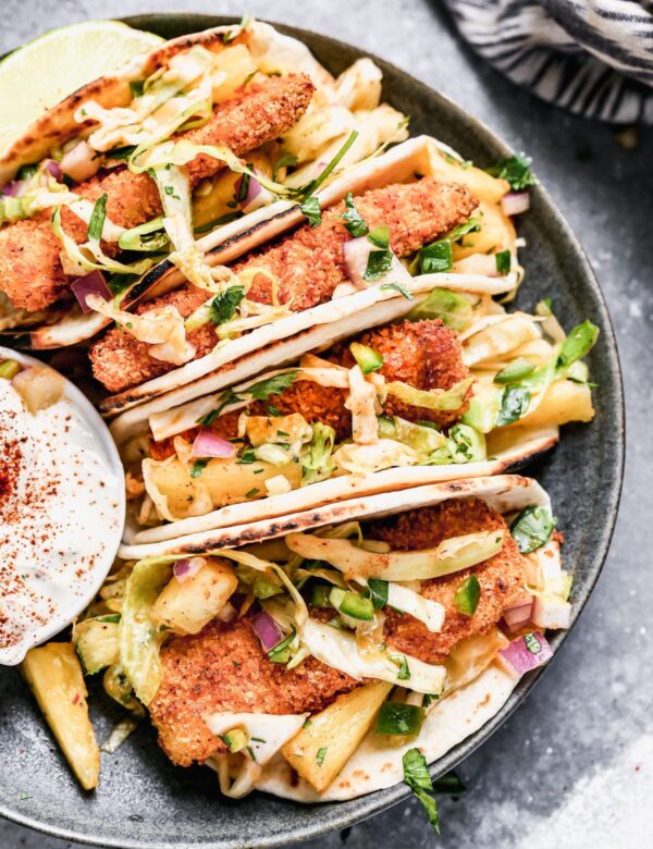 Ultra crispy breaded fish filets nestled into charred flour tortillas and topped with a sweet and spicy pineapple slaw, our Air Fryer Tacos are sure to be your new favorite taco.