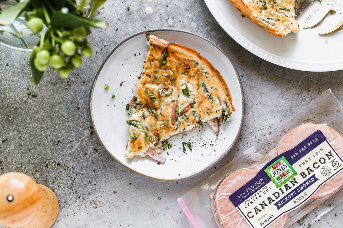 Crispy and puffed on the edges, with the most luscious custard-like inside, our Savory Dutch baby is going to be the showstopper of your next spring brunch. We toss Canadian Bacon, crispy asparagus, and nutty gruyere together and then sprinkle it over our fool-proof dutch baby batter.