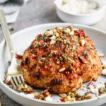 Visually beautiful and even tastier to eat, our Whole Roasted Cauliflower is THE vegetable recipe worthy of a permanent place in your dinner rotation. We steam a whole head of cauliflower, rub with with spices and then roast until it's tender on the inside and ultra crispy on top.  We cover it in an easy Calabrian Chili Chimichurri, sprinkle with toasted pine nuts, and finish it off with salty feta cheese. Eat a whole one for a meal or share with others as a side dish.