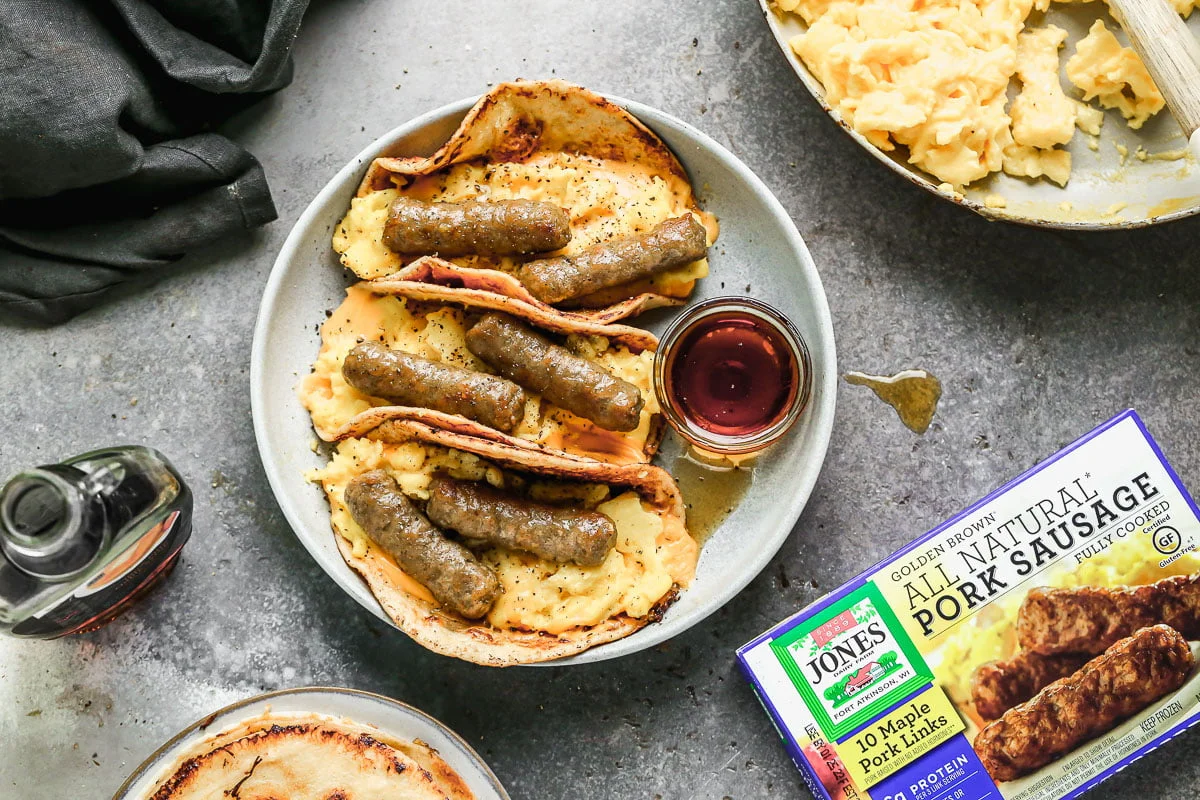 Classic egg sandwich meets classic French toast in our French Toast Sausage and Egg Tacos. We take flour tortillas, drown them in an easy French toast batter and cook them in just enough butter to turn them irresistibly golden and crisp. We layer them with melty American cheese, the softest custard-like scrambled eggs, and maple sausage for the perfect sweet and salty breakfast we're completely obsessed with.